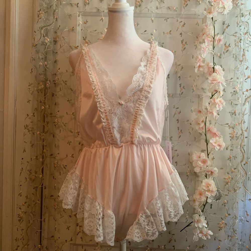 pink lace bodysuit with ruffles and lace trim